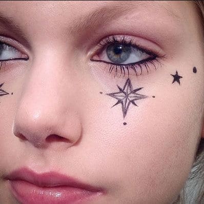 Pregnant mom with tattoo on her face