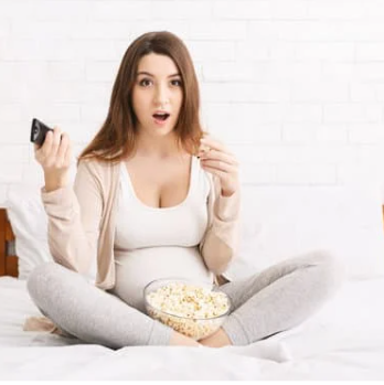 Pro Tip Pregnate woman with TV controller